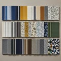 Assorted fabric samples displayed in a grid pattern on a neutral surface Royalty Free Stock Photo