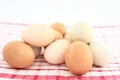 Assorted Farm Fresh Eggs On Kitchen Fabric