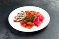 Assorted fish cut into slices. Salmon, eel, tuna, trout. Decorated with red caviar Royalty Free Stock Photo