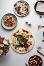 Assorted food, banquet table with snacks, Italian appetizers on a white table, top view, assorted sausages, assorted Royalty Free Stock Photo