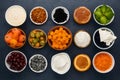 Assorted food ingredients arranged against a kitchen table background