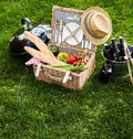 Assorted food sitting inside picnic basket Royalty Free Stock Photo