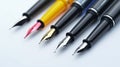 Assorted fountain pens with different nibs and colors arranged in a row on a white background Royalty Free Stock Photo