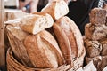 Assorted fresh baked loaves of bread on the market counter. Royalty Free Stock Photo