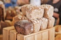 Assorted fresh baked loaves of bread on the market counter. Royalty Free Stock Photo