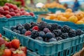 Assorted fresh berries in market baskets