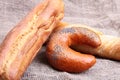 Assorted fresh breads isolated on old sackcloth. Royalty Free Stock Photo