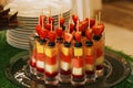 Assorted fresh fruits on a skewer in a glass Royalty Free Stock Photo