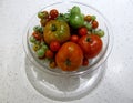 Assorted fresh organic colorful tomatoes in a glass bowl. Royalty Free Stock Photo
