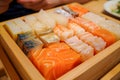Assorted Fresh Sushi and Sashimi Platter Display in a Wooden Serving Tray in a Japanese Restaurant Royalty Free Stock Photo