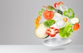 Assorted fresh vegetables flying in a plate Royalty Free Stock Photo