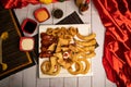 Assorted fried snacks platter with fried onion rings, shrimps, crackers, bq chicken wings, soy mayo dip sauce and black pepper Royalty Free Stock Photo