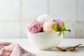 Assorted fruit and berries ice cream in a bowl, lemon, strawberry and peach Royalty Free Stock Photo