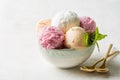 Assorted fruit and berries ice cream in a bowl, lemon, strawberry and peach flavours Royalty Free Stock Photo
