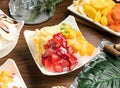 Assorted fruit ice cream mango, banana,strawberry served in bowl isolated on table side view of taiwan food