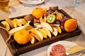 assorted fruit platter on wooden tray. delicious and healthy snack for banquet. Royalty Free Stock Photo