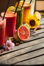 Assorted fruit smoothies on wooden table Royalty Free Stock Photo