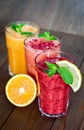 Assorted fruit smoothies on a wooden table Royalty Free Stock Photo