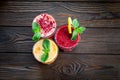 Assorted fruit smoothies on a wooden table Royalty Free Stock Photo