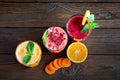Assorted fruit smoothies on a wooden table Royalty Free Stock Photo
