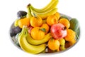 Assorted fruit and vegetable platter of bananas, pomegranate, lemon, tangerine and avocado Royalty Free Stock Photo