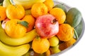 Assorted fruit and vegetable platter of bananas, pomegranate, lemon, tangerine and avocado Royalty Free Stock Photo