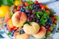 assorted fruits and berries on a plate. delicious and healthy vegetarian dessert Royalty Free Stock Photo