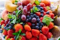 assorted fruits and berries on a plate. delicious and healthy vegetarian dessert Royalty Free Stock Photo