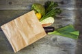 Assorted fruits and vegetables in brown grocery bag Royalty Free Stock Photo