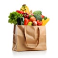 Assorted fruits and vegetables in brown grocery bag isolated over white background Royalty Free Stock Photo