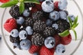 Mixed berries in glass bowls closeup, top view Royalty Free Stock Photo