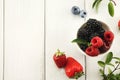 Mixed berries in glass bowls closeup, top view Royalty Free Stock Photo