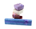 Assorted gift box long blue and a stack of lilac and red box on an isolated background Royalty Free Stock Photo