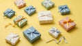 Assorted gift boxes with ribbons on yellow background Royalty Free Stock Photo