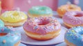 Assorted glazed donuts with sprinkles on pastel plates Royalty Free Stock Photo