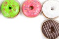 Assorted glazed doughnuts in different colors Royalty Free Stock Photo