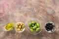 Assorted green and black olives in a bowl on a dark rustic background. View from above,copy space Royalty Free Stock Photo