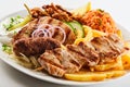 Assorted grilled meat with chips and salad