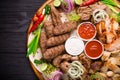 Assorted grilled meat and vegetables on rustic table Royalty Free Stock Photo