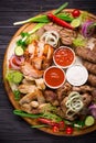 Assorted grilled meat and vegetables on rustic table Royalty Free Stock Photo