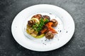 Assorted grilled vegetables: mushrooms, peppers, paprika, zucchini and eggplant on a plate. Royalty Free Stock Photo