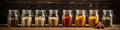 Assorted ground spices in bottles on wooden background. Royalty Free Stock Photo