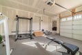 Assorted gym and fitness equipment in a garage