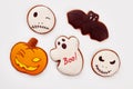 Assorted Halloween cookies on white background.