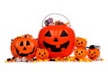 Assorted Halloween Jack o Lantern candy pails isolated on white