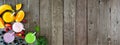 Assorted healthy fruit smoothies, above view corner border banner against a wood background