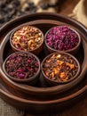 Assorted herbal tea selection in wooden bowls on a wooden tray Royalty Free Stock Photo