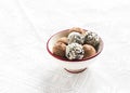 Assorted homemade dark chocolate truffles in a white ceramic bowl Royalty Free Stock Photo