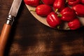 Assorted hot chilli pepper and rustic knife on the side over wooden surface Royalty Free Stock Photo