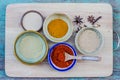 Assorted hot spicy powders in ceramic bowls Royalty Free Stock Photo